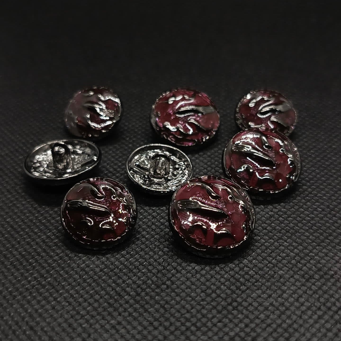 Ornate Dark Colored Metal Buttons