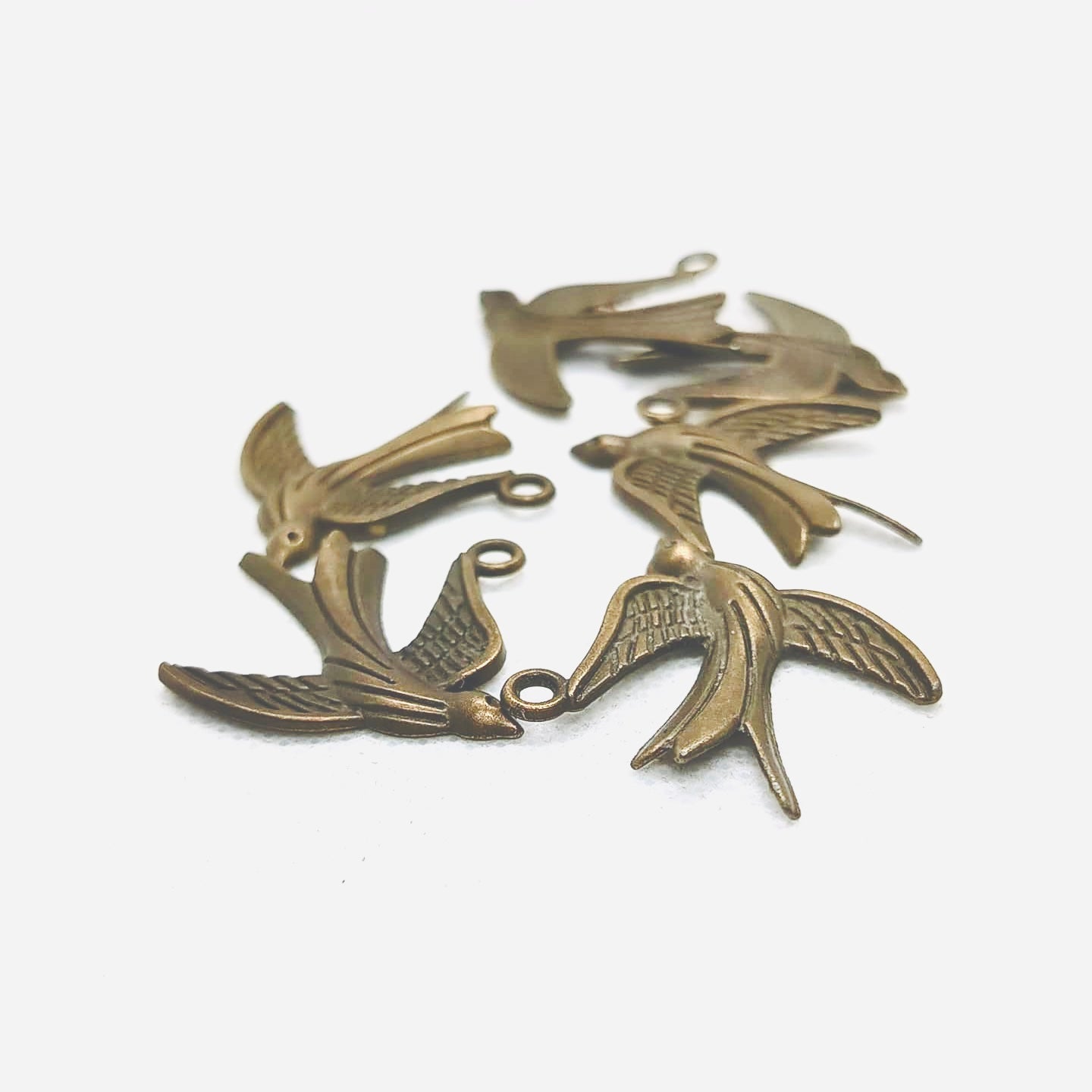 The Soaring Swallow Charm